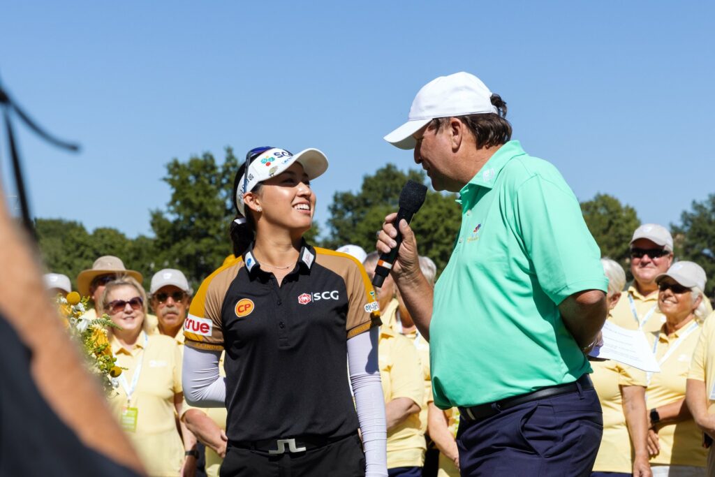 The 2022 LPGA champion talks on a microphone with a news reporter