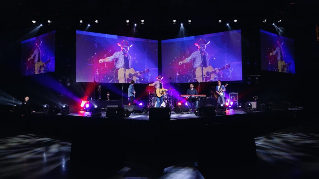 A country music band plays during a concert-style break in the main gala. 